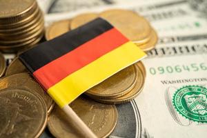 Stack of coins with USA Germany flag on white background. photo