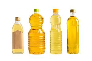 Vegetable oil with olive oil in different bottle for cooking isolated on white background with clipping path. photo