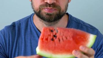 Bearded man eats a juicy watermelon video