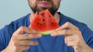 Bearded man eats a juicy watermelon video