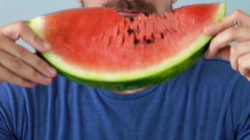 Bearded man eats a juicy watermelon video