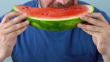 Bearded man eats a juicy watermelon video