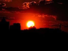 Autumn red sunset with a purple sky photo