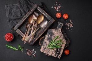 Vintage rectangular shabby wooden box with spoons and forks photo