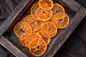 Beautiful Christmas decoration consisting of an old wooden box with dried citrus fruits photo