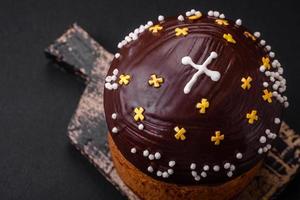Freshly baked Easter cake or panettone with chocolate coating photo