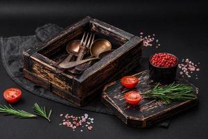 Vintage rectangular shabby wooden box with spoons and forks photo