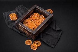 Beautiful Christmas decoration consisting of an old wooden box with dried citrus fruits photo