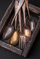 Vintage rectangular shabby wooden box with spoons and forks photo