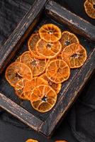 Beautiful Christmas decoration consisting of an old wooden box with dried citrus fruits photo