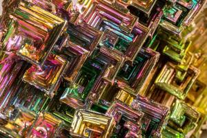 Macro of the mineral bismuth stone on a white background photo