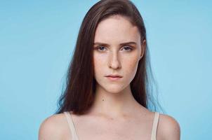 Brunette woman on blue background photo