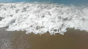 Slow motion of large wave breaking on the beach with foam and surf video