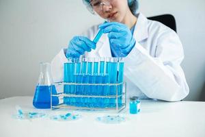 Asian young  student scientist researching and new chemical substances in a laboratory. photo