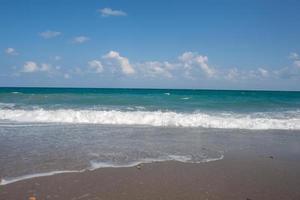 waves sand and sea. Nature landscape view of beautiful tropical beach and sea in sunny day. Beach sea space area photo