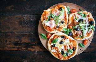 variety of small pizzas photo