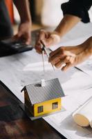 Architect concept, Architects working with blueprints in the office, Vintage Effect photo