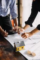 Architect concept, Architects working with blueprints in the office, Vintage Effect photo
