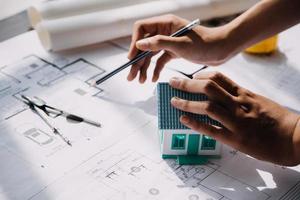 Architect concept, Architects working with blueprints in the office, Vintage Effect photo