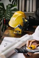 Architect concept, Architects working with blueprints in the office, Vintage Effect photo