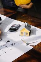 Architect concept, Architects working with blueprints in the office, Vintage Effect photo