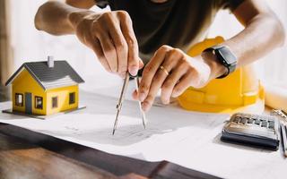 Architect concept, Architects working with blueprints in the office, Vintage Effect photo