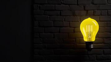 Yellow lighting bulb on dark background. Illustration photo