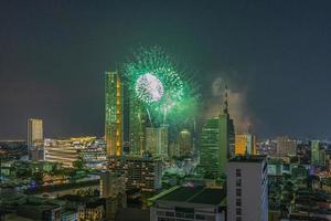 Aerial view of a fireworks display over the Chao Phraya River in Bangkok photo