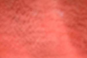Abstract and blurry background of red fabric cotton. photo