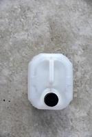 White plastic large canister. An empty plastic canister. photo