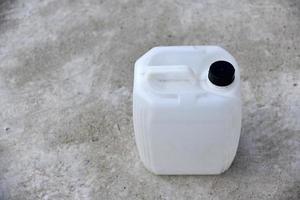 White plastic large canister. An empty plastic canister. photo