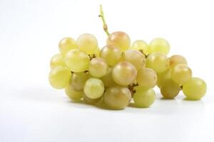 Vine of fresh green Muscat grapes, isolate on white background. Sprig of organic natural food. . photo
