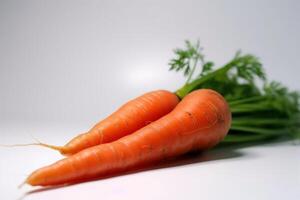 Fresh carrots with leaves, isolate on a white background. Macro studio shot. . photo
