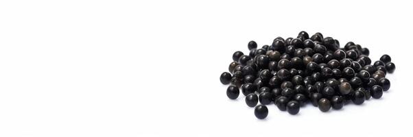 Black caviar in bulk on a white background. Elite exotic delicacy. . Header banner mockup with space. photo