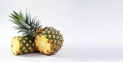 Isolated ripe fresh pineapple with leaf on white background. Vitamin-rich fruit. . photo