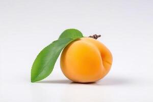 Isolated ripe fresh apricot with leaf on white background. Vitamin-rich fruit. . photo
