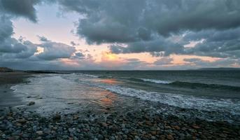 Dramatic coastal landscape sunrise scenery at Salthill beach in Galway city, Ireland photo