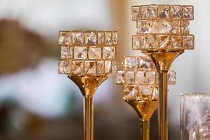 festive wedding table decoration with crystal gold candlesticks and candles. wedding day. High quality photo