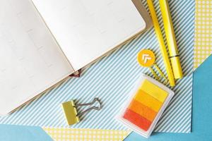 School supplies. Yellow and blue colors. Empty notebook. Flat lay composition. Space for text. photo