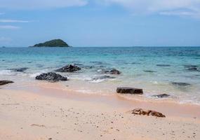 Landscape summer front view  tropical sea beach rock blue white sand background calm Nature ocean Beautiful wave crash splashing water travel Nang Ram Beach East thailand Chonburi Exotic horizon. photo