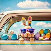 Cute Easter Bunny with sunglasses looking out of a car filed with easter eggs, photo