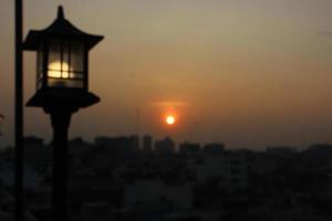 Photo of a lantern with a sunset background