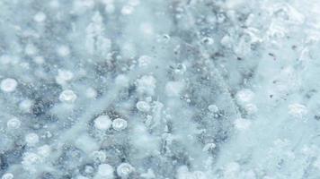 Close up glacier lagoon texture and pattern close up background video