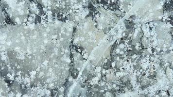 Close up glacier lagoon texture and pattern close up background video