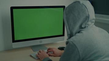 male using computer sitting at the desk video