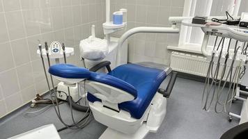 Dental office and dental chair for dental treatment. photo