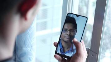 Taking online consultation with doctor on smart phone video