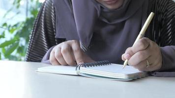 top view of woman hand writing on notepad video