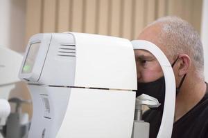 An ophthalmologist checks the fundus of the patient. photo