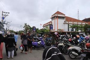 Tegal, January 2023. Photo portrait of vehicles parking at the old town hall alun alun tegal visiting vendors selling various kinds.